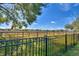 View of a fence with open fields beyond at 4481 Reding Way, Lakeland, FL 33813