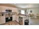 Stainless steel appliances and white shaker cabinets in this updated kitchen at 4481 Reding Way, Lakeland, FL 33813