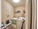 Laundry room with washer, dryer, and shelving at 4481 Reding Way, Lakeland, FL 33813