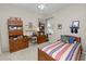 Bedroom setup with a bed, desk and lots of storage and natural light at 766 Bryson Loop, Lakeland, FL 33809