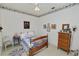 Bright bedroom with a floral border, wooden bed, dresser, and plenty of natural light at 766 Bryson Loop, Lakeland, FL 33809