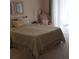 Bedroom with a green bedspread and sitting chair at 766 Bryson Loop, Lakeland, FL 33809