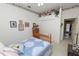 Cozy bedroom with charming decor, a wooden bed, floral accents, and an attached closet at 766 Bryson Loop, Lakeland, FL 33809