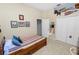 Simple bedroom with single bed, sports decor, closet and neutral walls at 766 Bryson Loop, Lakeland, FL 33809