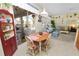 Cozy dining area with pool view, features a wooden table with 4 chairs adjacent to the living room at 766 Bryson Loop, Lakeland, FL 33809