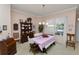 Charming dining room featuring dark wood furniture, chandelier lighting, and a window view at 766 Bryson Loop, Lakeland, FL 33809