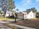 Street view of the property showcasing the driveway, landscaping and facade of this lovely home at 766 Bryson Loop, Lakeland, FL 33809