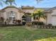 Charming home featuring manicured lawn, beautiful landscaping, and welcoming front entrance at 766 Bryson Loop, Lakeland, FL 33809