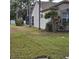 View of house showcasing a screened patio area at 766 Bryson Loop, Lakeland, FL 33809