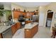 Kitchen featuring stainless steel appliances, granite counters, and adjacent breakfast area at 766 Bryson Loop, Lakeland, FL 33809