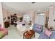 Spacious living room featuring elegant furniture, chandelier, and lots of natural light at 766 Bryson Loop, Lakeland, FL 33809