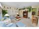 Cozy living room with view into the kitchen, and an entertainment center at 766 Bryson Loop, Lakeland, FL 33809