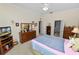 Spacious main bedroom featuring a dresser, TV, and two doors leading to other rooms at 766 Bryson Loop, Lakeland, FL 33809