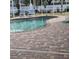 Pool area with brick pavers and screened enclosure at 766 Bryson Loop, Lakeland, FL 33809