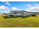 Single-story home exterior with lawn and sunlit facade at 108 Dogwood Trl, Leesburg, FL 34748