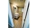 Bathroom featuring updated vanity with drawers, mirror, and towel rack at 100 Papaya Cv, Leesburg, FL 34748