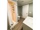 Cozy bathroom with a shower and new vanity, painted in a modern grey at 100 Papaya Cv, Leesburg, FL 34748