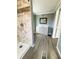 Bathroom featuring updated vanity, shower with decorative tile, and modern fixtures at 100 Papaya Cv, Leesburg, FL 34748
