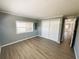 Bright bedroom with closet and door at 100 Papaya Cv, Leesburg, FL 34748