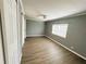 This light-filled bedroom features a ceiling fan and large window at 100 Papaya Cv, Leesburg, FL 34748