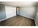 Bedroom with closet, window, and grey walls with white trim at 100 Papaya Cv, Leesburg, FL 34748