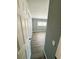 Bedroom with grey painted walls and wood flooring at 100 Papaya Cv, Leesburg, FL 34748