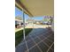 Inviting covered parking area with tiled flooring and space for parking and outdoor enjoyment at 100 Papaya Cv, Leesburg, FL 34748