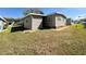 This home has a beautiful landscaped yard with irrigation system at 100 Papaya Cv, Leesburg, FL 34748