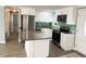 This updated kitchen features stainless steel appliances and an island at 100 Papaya Cv, Leesburg, FL 34748