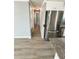 Bright kitchen featuring stainless steel appliances and modern cabinets at 100 Papaya Cv, Leesburg, FL 34748