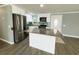 Bright kitchen with stainless steel appliances and a functional island at 100 Papaya Cv, Leesburg, FL 34748