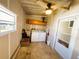 Unfinished laundry room area with washer, dryer, sink and storage cabinets at 100 Papaya Cv, Leesburg, FL 34748
