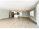 Bright, open living space with a modern kitchen and stainless steel appliances at 100 Papaya Cv, Leesburg, FL 34748