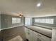 Open-concept living room flowing into a kitchen with an island, perfect for modern living at 100 Papaya Cv, Leesburg, FL 34748