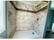 Close up of a shower with decorative tile and modern fixtures at 100 Papaya Cv, Leesburg, FL 34748