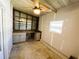 This storage room features ample shelving, workspace and ceiling fan at 100 Papaya Cv, Leesburg, FL 34748