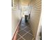 Exterior view of walkway between homes leading to back of property at 100 Papaya Cv, Leesburg, FL 34748