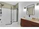 Modern bathroom featuring a glass-enclosed shower, stylish vanity, and contemporary fixtures at 1411 Juarez Pl, The Villages, FL 32159