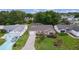 Charming single-story home featuring a manicured front yard, paver driveway and attached garage in a peaceful neighborhood setting at 1411 Juarez Pl, The Villages, FL 32159