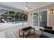 Covered lanai featuring ceiling fan and seating area at 1411 Juarez Pl, The Villages, FL 32159