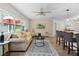 Bright and airy living room featuring views, plush seating, and a stylish area rug at 1411 Juarez Pl, The Villages, FL 32159