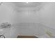 Large walk-in closet with metal shelving and wood floor at 1411 Juarez Pl, The Villages, FL 32159