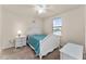 Charming bedroom with white bed frame and teal bedding at 1567 Candlefire Row, Kissimmee, FL 34744