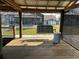Inviting porch with a swing overlooking the canal and surrounding yard at 1618 Juno Trail, Astor, FL 32102