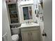 Charming bathroom features a vanity with storage, accent lighting and a toilet at 1618 Juno Trail, Astor, FL 32102