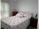 Bedroom featuring a bed with flamingo patterned bedding and coordinating decor at 1618 Juno Trail, Astor, FL 32102