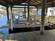 Wooden boat lift and dock overlooking the water, ready for lake activities at 1618 Juno Trail, Astor, FL 32102