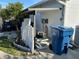 Exterior view with well and trash bin, showing practicality and maintenance features at 1618 Juno Trail, Astor, FL 32102