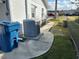 Exterior of home, trash bins, AC unit, walkway, and fenced yard at 1618 Juno Trail, Astor, FL 32102