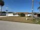 Charming single-story home with a well-manicured lawn and attached garage at 1618 Juno Trail, Astor, FL 32102